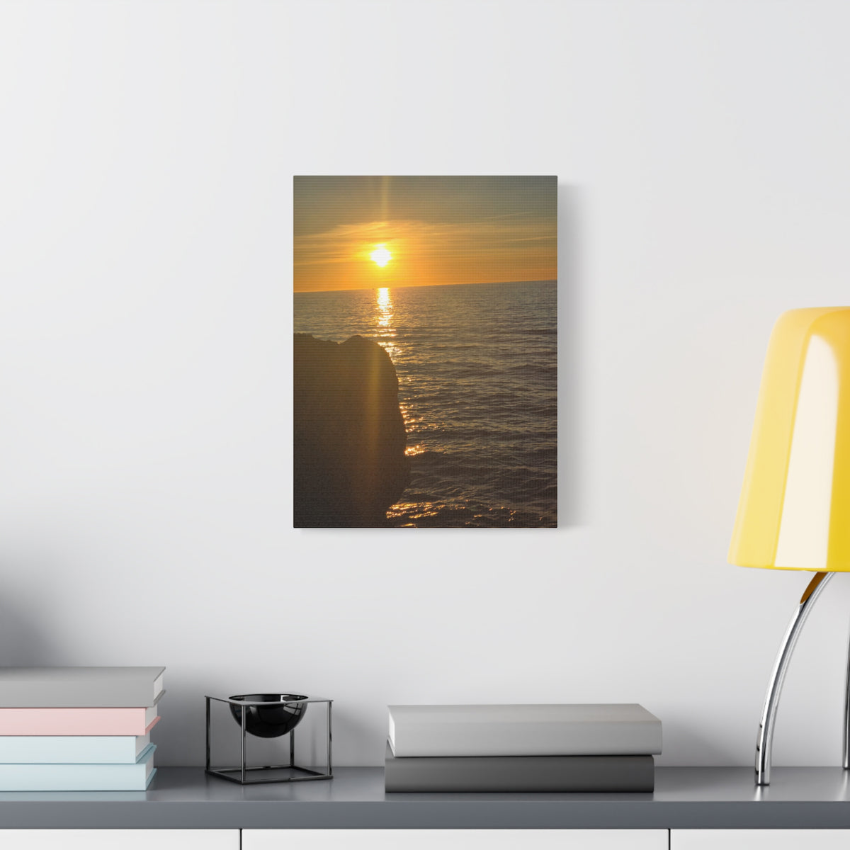Break Wall Ocean View canvas print — coastal sunset art displayed above a modern desk in a dark-walled room